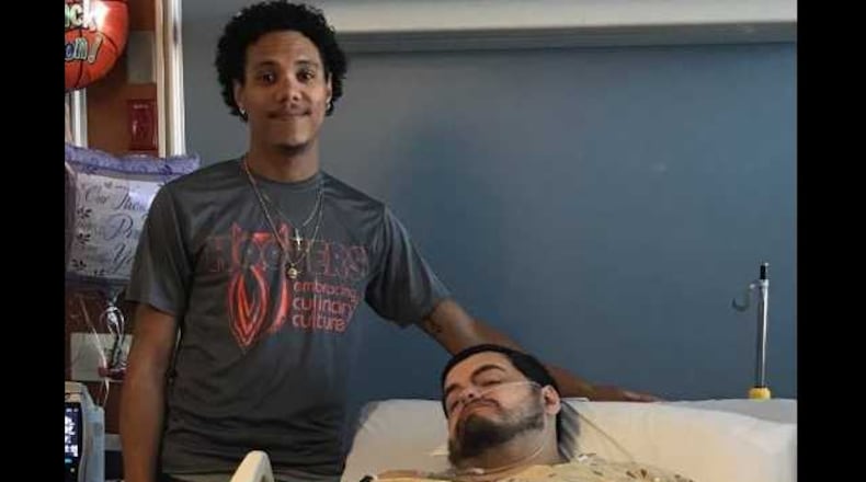 Jacksonville Landing victim and Hooters worker who saved him reunite