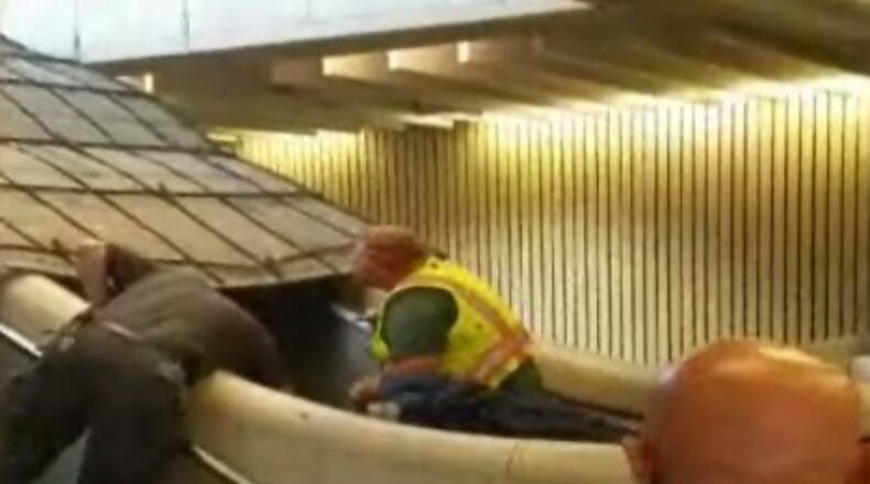 MARTA personnel work to clear part of a ceiling that fell at the Five Points station. (Credit: Channel 2 Action News)