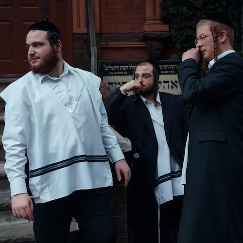 FILE - Hasidic Jewish men chat on June 16, 2025, in the Brooklyn borough of New York. (AP Photo/Andres Kudacki, File)