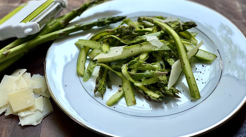 Parmesan slices are one way to dress up Shaved Asparagus Salad. CONTRIBUTED BY KELLIE HYNES