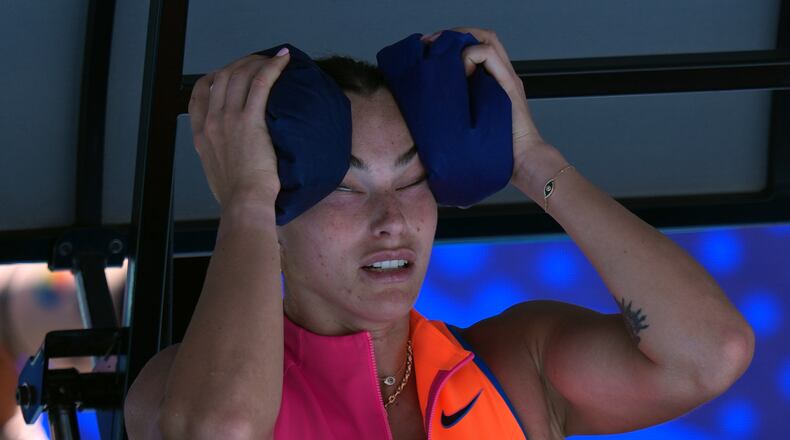 Aryna Sabalenka of Belarus places ice packs to her face during her quarterfinal match against to Iva Jovic of the U.S. at the Australian Open tennis championship in Melbourne, Australia, Tuesday, Jan. 27, 2026. (AP Photo/Aaron Favila)