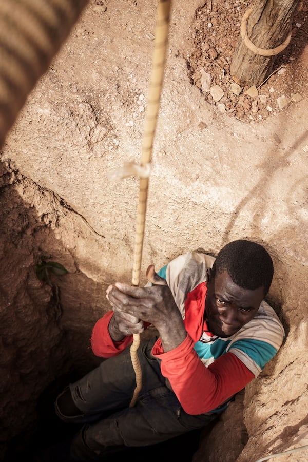 A worker pulls himself from a gold mining pit in the Kedougou region of Senegal on Thursday, Jan. 16, 2025. (AP Photo/Annika Hammerschlag)