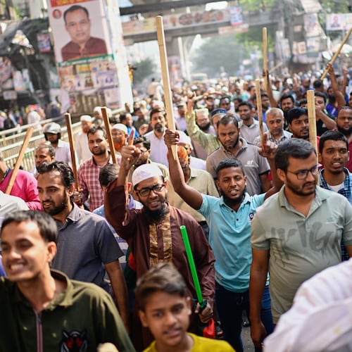 Activists of Bangladesh's Jamaat-e-Islami party stage a protest rally against a nationwide "lockdown" called by ousted Prime Minister Sheikh Hasina and her former ruling Awami League party, in Dhaka, Bangladesh, Thursday, Nov. 13, 2025. (AP Photo/Mahmud Hossain Opu)