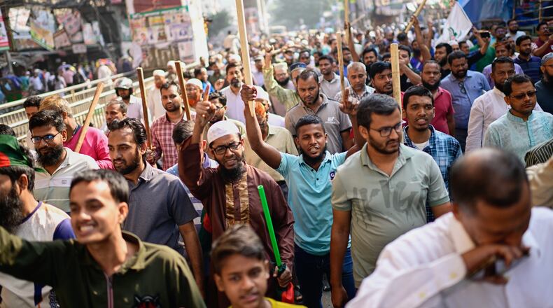 Activists of Bangladesh's Jamaat-e-Islami party stage a protest rally against a nationwide "lockdown" called by ousted Prime Minister Sheikh Hasina and her former ruling Awami League party, in Dhaka, Bangladesh, Thursday, Nov. 13, 2025. (AP Photo/Mahmud Hossain Opu)