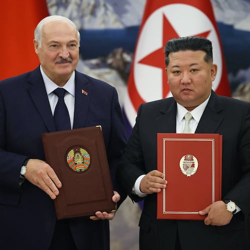 In this photo released by Belarus' Presidential Press Service, North Korea's leader Kim Jong Un, right, and Belarusian President Alexander Lukashenko hold signed documents during their meeting in Pyongyang, North Korea, Thursday, March 26, 2026. (Belarus' Presidential Press Service via AP)