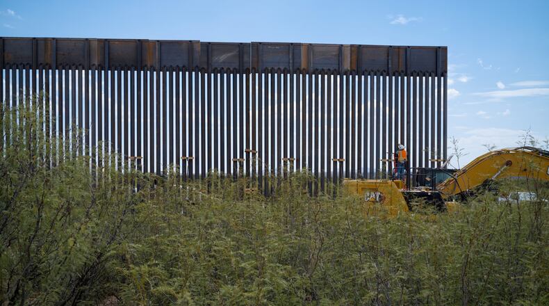 In this photo provided by Scott McWilliams, crews install the first sections of a new border wall in the Big Bend region of west Texas, on Sept. 16, 2026. (Scott McWilliams via AP)