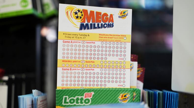 FILE - Mega Millions Lottery play slips are displayed for customers at a convenience store in Chicago, Sunday, April 6, 2025. (AP Photo/Nam Y. Huh, file)