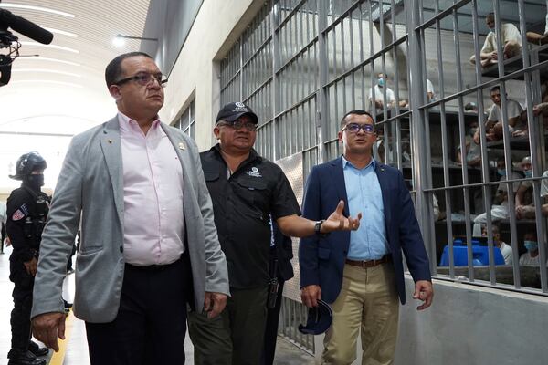 Costa Rica's Justice and Peace Minister Gerald Campos Valverde, left, tours the Terrorist Confinement Center in Tecoluca, El Salvador, Friday, April 4, 2025. (AP Photo/Salvador Melendez)