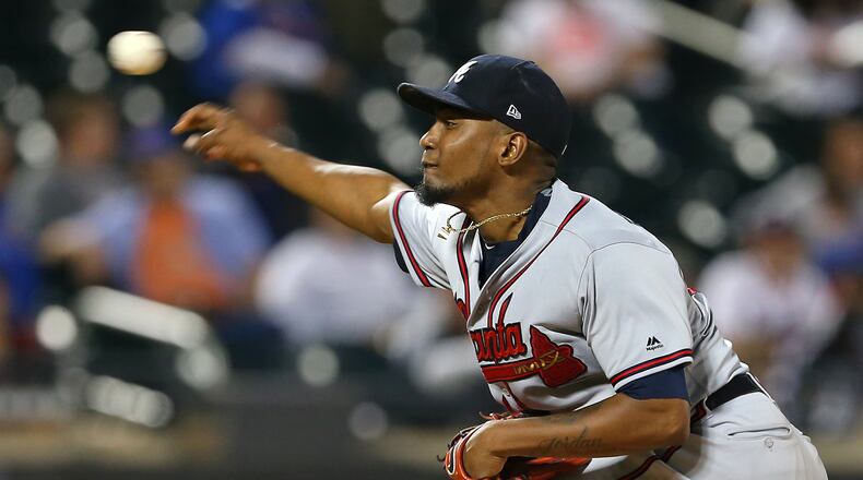 Pitcher Julio Teheran #49 of the Atlanta Braves delivers a pitch against the New York Mets. (Photo by Rich Schultz/Getty Images)
