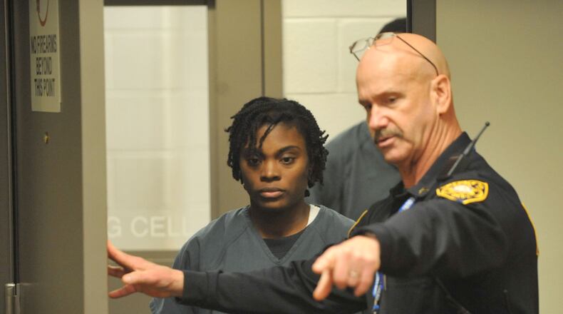 Tiffany Moss enters a Gwinnett County courtroom for her first appearance hearing after being charged with the murder of her stepdaughter, Emani. (KENT D. JOHNSON / KDJOHNSON@AJC.COM)