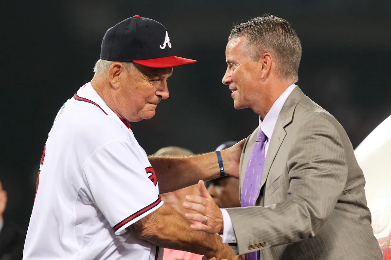 Braves manager Bobby Cox embraces pitcher Tom Glavine on stage during his uniform number retirement in a pre-game ceremony at Turner Field in Atlanta, Friday, August 6, 2010, before the game vs. the San Francisco Giants. Glavine's # 47 is the seventh Braves uniform number to be retired, joining Hank Aaron (44), Eddie Mathews (41), Dale Murphy (3), Phil Niekro (35), Warren Spahn (21), and Greg Maddux (31). Curtis Compton ccompton@ajc.com