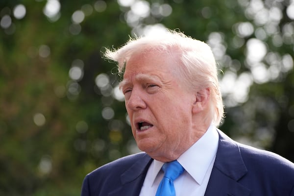 President Donald Trump speaks with reporters as he and first lady Melania Trump depart on Marine One from the South Lawn of the White House, Friday, April 25, 2025, in Washington. The President and first lady will be traveling to Rome and the Vatican to attend the funeral for Pope Francis. (AP Photo/Alex Brandon)