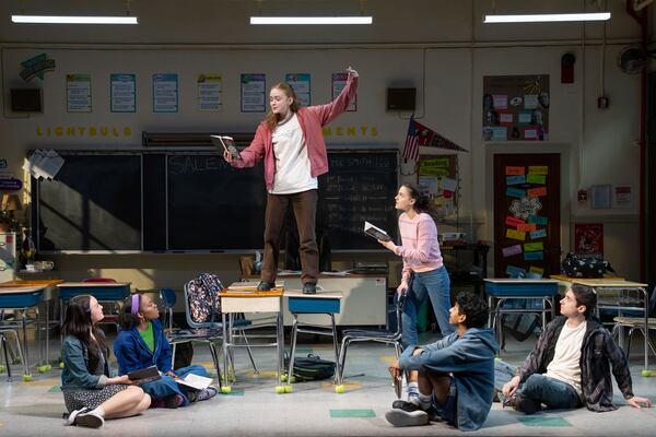This image released by O&M/DKC shows, from left, Amelia Yoo, Morgan Scott, Sadie Sink, Fina Strazza, Nihar Duvvuri and Hagan Oliveras during a performance of "John Proctor Is the Villain" in New York. (Julieta Cervantes/O&M/DKC via AP)