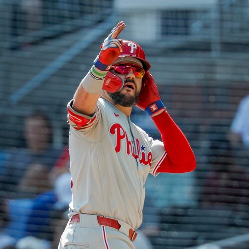 Philadelphia Phillies designated hitter Kyle Schwarber reacts after hitting a two-run single against the Atlanta Braves during the eighth inning of a baseball game, Sunday, Sept. 13, 2026, in Atlanta. (AP Photo/Erik S. Lesser)
