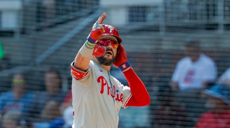 Philadelphia Phillies designated hitter Kyle Schwarber reacts after hitting a two-run single against the Atlanta Braves during the eighth inning of a baseball game, Sunday, Sept. 13, 2026, in Atlanta. (AP Photo/Erik S. Lesser)