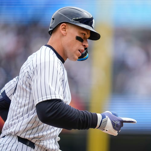New York Yankees' Aaron Judge (99) celebrates after hitting a two-run home run during the first inning of the Yankees' home-opener baseball game against the Miami Marlins, Friday, April 3, 2026, in New York. (AP Photo/Yuki Iwamura)