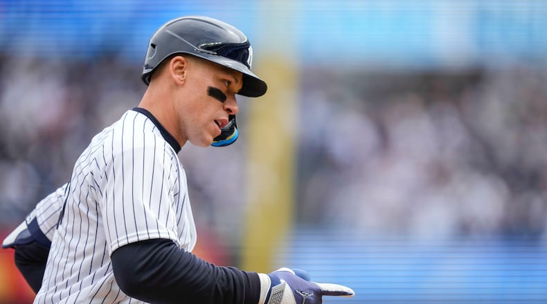 New York Yankees' Aaron Judge (99) celebrates after hitting a two-run home run during the first inning of the Yankees' home-opener baseball game against the Miami Marlins, Friday, April 3, 2026, in New York. (AP Photo/Yuki Iwamura)