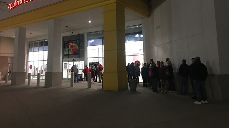 Shoppers wait out in front of hhgregg on Black Friday 2016.