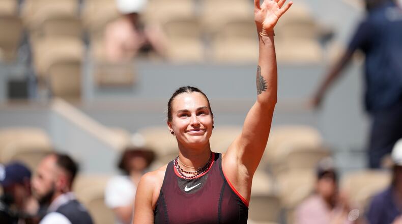 Aryna Sabalenka of Belarus celebrates after winning against Jessica Bouzas Maneiro of Spain during their first round women's singles tennis match at the French Open tennis tournament in Paris, Tuesday, May 26, 2026. (AP Photo/Christophe Ena)