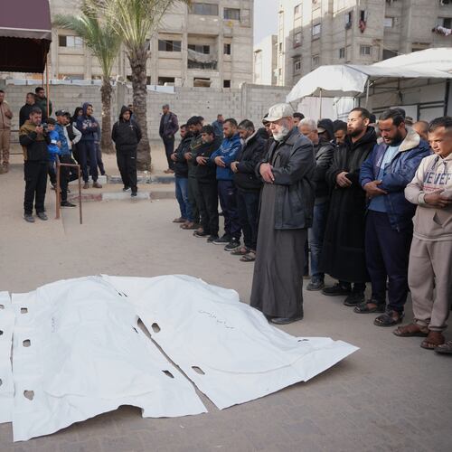 Palestinians mourn over the bodies of men who were killed in an Israeli military strike, during their funeral at Nasser Hospital in Khan Younis, Wednesday, Feb. 4, 2026. (AP Photo/Abdel Kareem Hana)