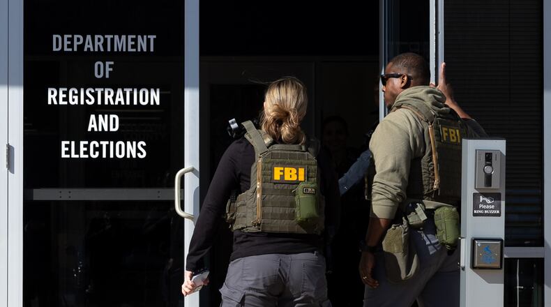 FBI agents enter the Fulton County Election Hub and Operation Center in Union City on Wednesday, Jan. 28, 2026. (Arvin Temkar/AJC)