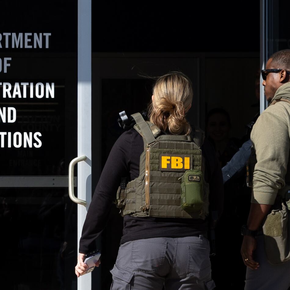 FBI agents enter the Fulton County Election Hub and Operation Center in Union City on Wednesday, Jan. 28, 2026. (Arvin Temkar/AJC)