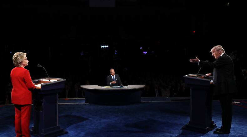 HEMPSTEAD, NY - SEPTEMBER 26: Republican presidential nominee Donald Trump (R) speaks as Democratic presidential nominee Hillary Clinton and Moderator Lester Holt listens during the Presidential Debate at Hofstra University on September 26, 2016 in Hempstead, New York. The first of four debates for the 2016 Election, three Presidential and one Vice Presidential, is moderated by NBC's Lester Holt. (Photo by Joe Raedle/Getty Images)