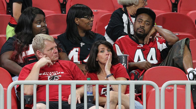 September 23, 2018 Atlanta: Atlanta Falcons fans sit dejected in the stands after falling 43-37 to the New Orleans Saints during overtime in an NFL football game on Sunday, Sept 23, 2018, in Atlanta.   Curtis Compton/ccompton@ajc.com