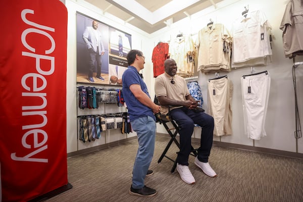 Shaquille O'Neal chats with Rodney Ho after the NBA legend's "Suit Up" event at JCPenney in the South Point Shopping Center, Friday, April 24, 2026. Shaq is also celebrating the launch of his brand-new fragrance, Eqlipse. (Jason Getz/AJC)