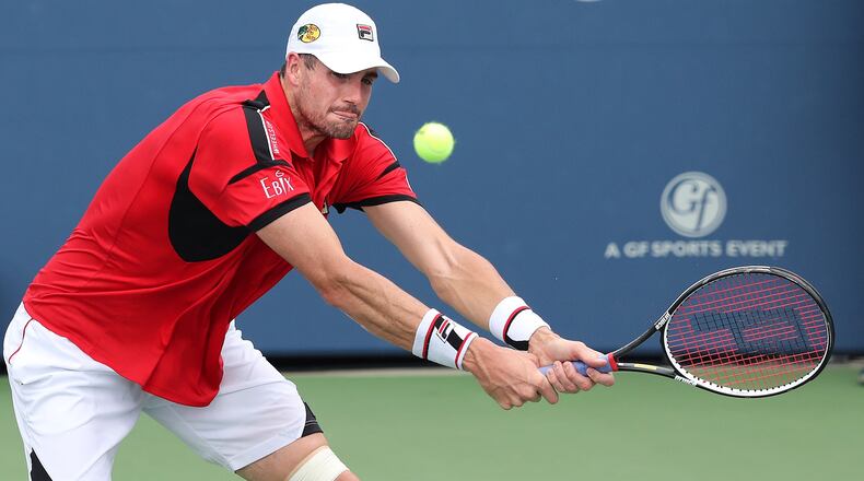 John Isner (USA) returns a volley to Nick Kyrgios (Australia) in the singles finals of the BB&T Atlanta Open on Sunday, August 7, 2016, in Atlanta.   Curtis Compton /ccompton@ajc.com