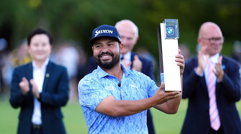 J. J. Spaun of United States lifts the trophy after winning the PGA Championship at Wentworth Golf Club in Virginia Water, England, Sunday Sept. 20, 2026. (Adam Davy/PA via AP)