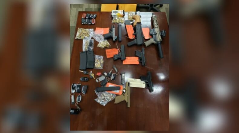 Guns, ammunition and key fobs from stolen vehicles were confiscated in a raid that resulted in the arrest of Keith Pharms, who was wanted after shooting at an FBI agent.