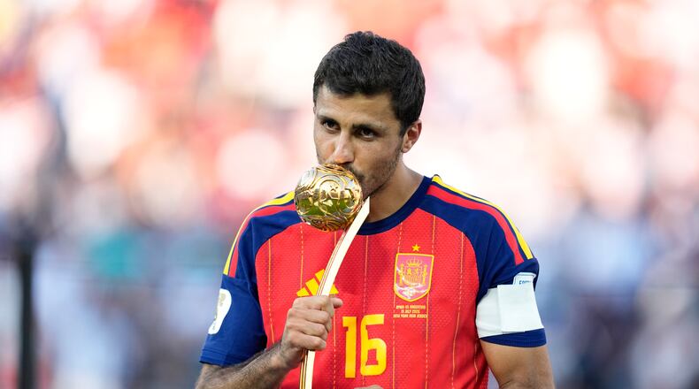 Spain's Rodri poses with the tournament's best player award at the end of the World Cup final soccer match between Spain and Argentina in East Rutherford, N.J., near New York, Sunday, July 19, 2026. (AP Photo/Ashley Landis)
