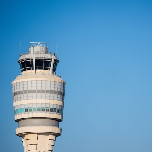 Several hundred flights were delayed and dozens of others were canceled Sunday after a weather-related ground stop at Hartsfield-Jackson Atlanta International Airport. (AP Photo/Mike Stewart)