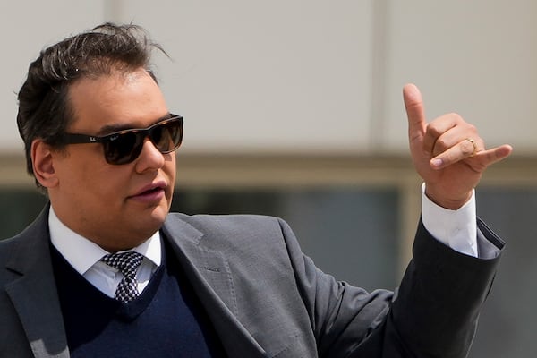 Former U.S. Rep. George Santos leaves federal court after being sentenced to more than seven years in prison for fraud and identity theft, Friday, April 25, 2025, in Central Islip, N.Y. (AP Photo/Julia Demaree Nikhinson)