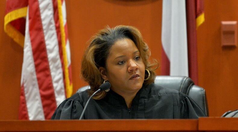 Suspended DeKalb County CEO Burrell Ellis appears before Judge Courtney L. Johnson in DeKalb County Superior Court during jury selection Monday, September 8, 2014. Ellis is accused of improperly pressuring county contractors for campaign contributions. KENT D. JOHNSON / KDJOHNSON@AJC.COM