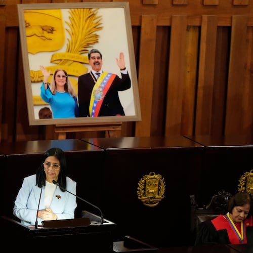 Venezuelan acting President Delcy Rodriguez speaks under a framed image of former President Nicolas Maduro and his wife Cilia Flores, during a ceremony marking the opening of the new judicial year at the Supreme Tribunal of Justice in Caracas, Venezuela, Friday, Jan. 30, 2026. (AP Photo/Ariana Cubillos)