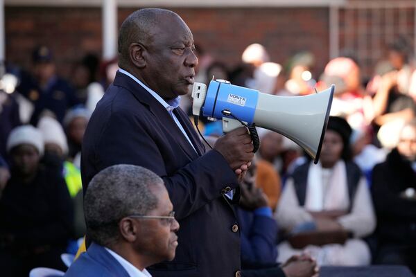 South African President Cyril Ramaphosa addresses victims of this week's floods in Mthatha, South Africa, Friday, June 13, 2025. (AP Photo/Themba Hadebe)