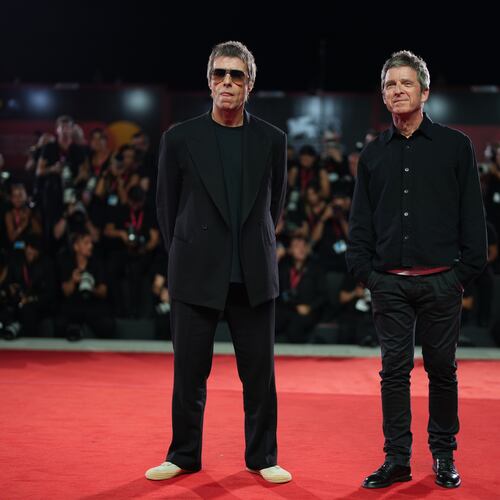 Liam Gallagher, left, and Noel Gallagher pose for photographers at the red carpet for the film 'Oasis: Don't Look Back In Anger' during the 83rd edition of the Venice Film Festival in Venice, Italy, on Saturday, Sept. 5, 2026. (Photo by Scott A Garfitt/Invision/AP)
