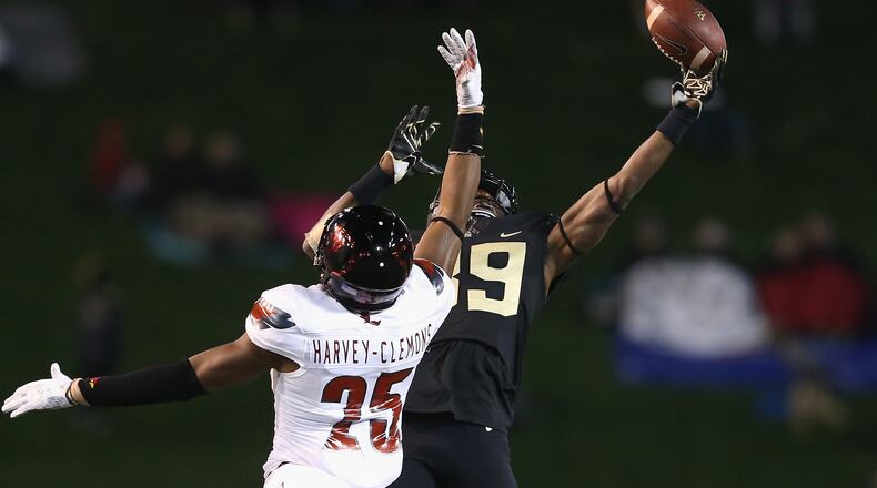 Former Georgia Bulldog Josh Harvey-Clemons of Louisville breaks up a pass to Chuck Wade of Wake Forest during their game at BB&T Field on October 30, 2015 in Winston Salem, North Carolina. (Photo by Streeter Lecka/Getty Images)