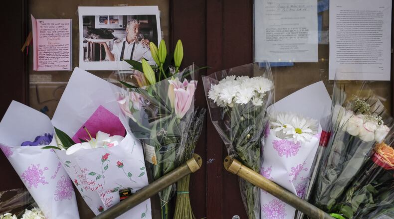 NEW YORK, NY - JUNE 8: Notes, photographs and flowers are left in memory of Anthony Bourdain at the closed location of Brasserie Les Halles, where Bourdain used to work as the executive chef, June 8, 2018 in New York City. Bourdain, a writer, chef and television personality, was found dead in his hotel room in France on Friday. His employer CNN confirmed the death as a suicide. (Photo by Drew Angerer/Getty Images)