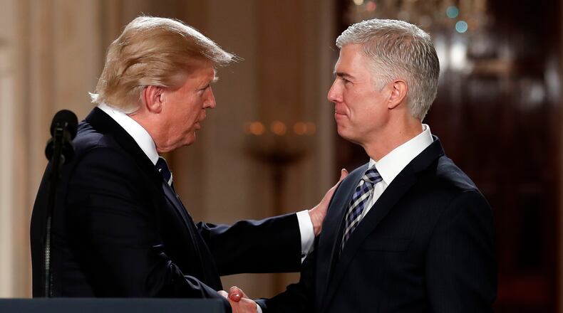President Donald Trump shakes hands with 10th U.S. Circuit Court of Appeals Judge Neil Gorsuch, his choice for Supreme Court associate justice in the East Room of the White House in Washington, Tuesday. (AP Photo / Carolyn Kaster)