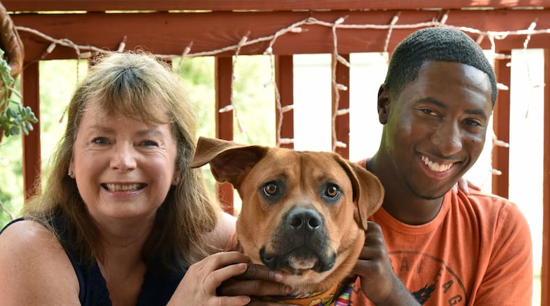 Vicki Van Der Hoek and Leon Shields with Vicki’s dog, Bobby, as Leon visited Vicki’s home in Morrow in August 2015. HYOSUB SHIN / HSHIN@AJC.COM