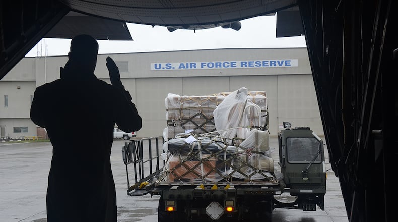 Members from Dobbins Air Reserve Base load supplies heading for Homestead Air Reserve Base in Florida's Miami-Dade County.
