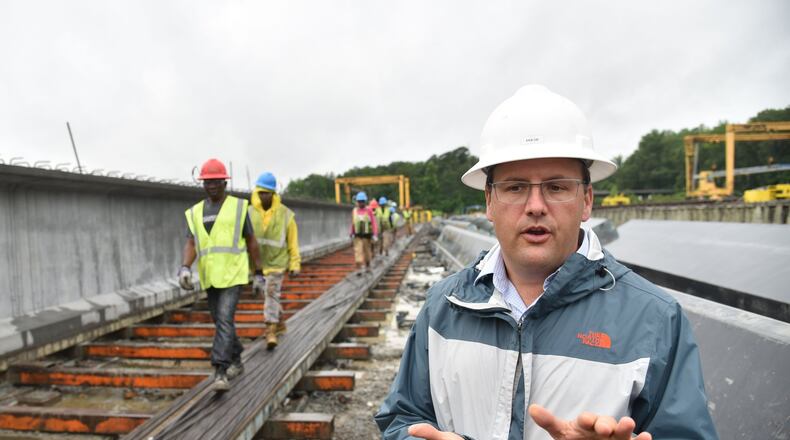 Mason Lampton, chief executive of Standard Concrete Products, explains how highway girders in the I-85 repair project were made at the company’s Atlanta location. It produced the girders at a record pace to get the job done. HYOSUB SHIN / HSHIN@AJC.COM