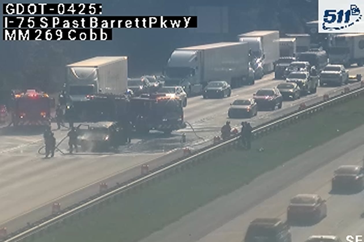 A car fire closed northbound lanes on I-75 just before the exit to Barrett Parkway on Monday morning. Traffic was blocked as crews cleaned up the aftermath, though at least one lane has since reopened. (Georgia Department of Transportation)