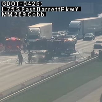 A car fire closed northbound lanes on I-75 just before the exit to Barrett Parkway on Monday morning. Traffic was blocked as crews cleaned up the aftermath, though at least one lane has since reopened. (Georgia Department of Transportation)