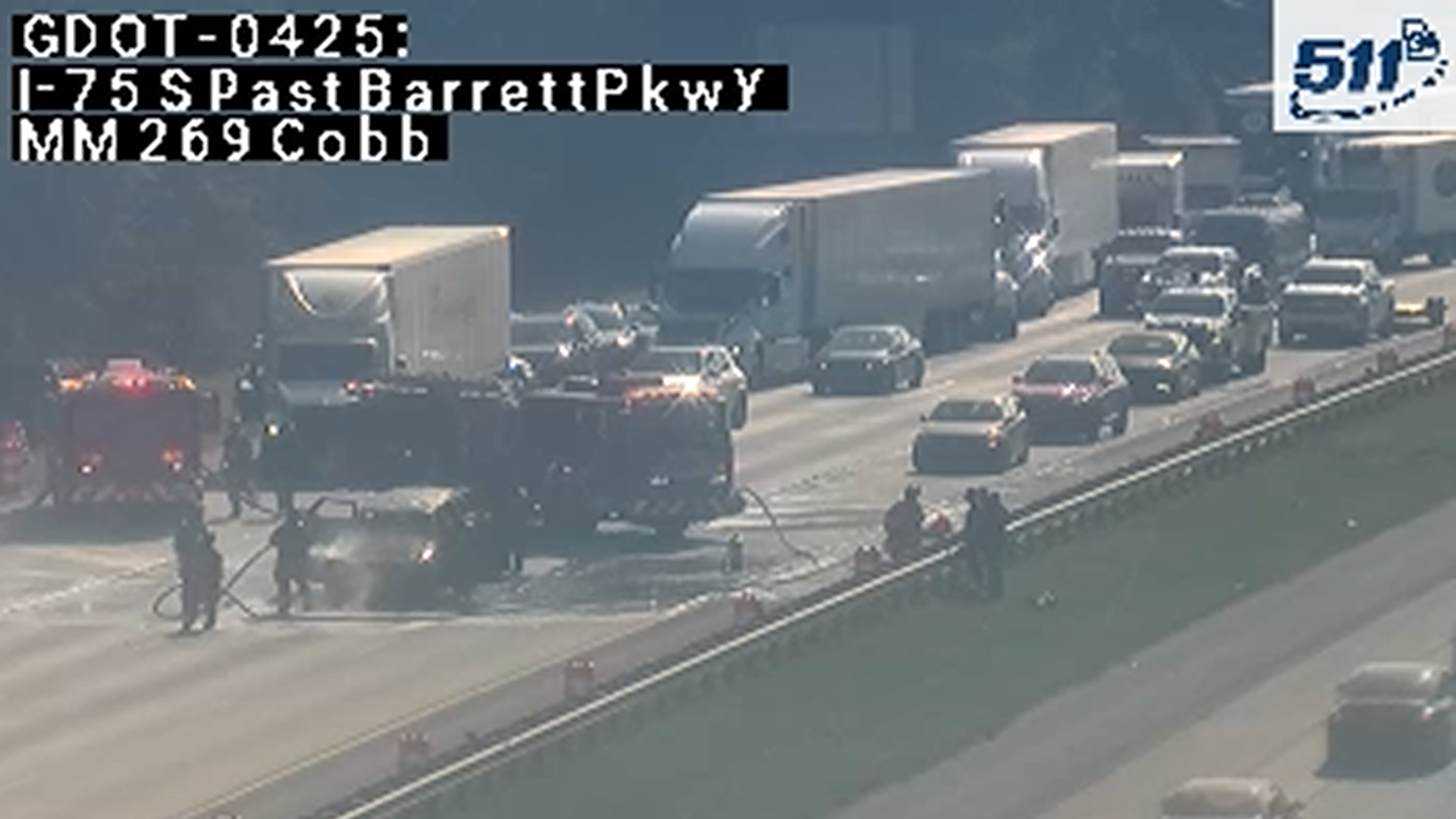 A car fire closed northbound lanes on I-75 just before the exit to Barrett Parkway on Monday morning. Traffic was blocked as crews cleaned up the aftermath, though at least one lane has since reopened. (Georgia Department of Transportation)