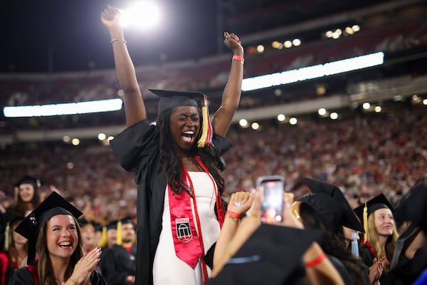 University of Georgia graduate Moni Okuwobi reacts as the degrees for the Franklin College of Arts and Sciences are conferred during the Spring Undergraduate Commencement at Sanford Stadium, Friday, May 8, 2026, in Athens, Ga. (Jason Getz/AJC)
