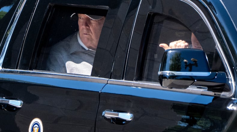 President Donald Trump looks out the window of his limousine at the construction in Lafayette Park as he departs the White House, Saturday, May 30, 2026, in Washington. (AP Photo/Alex Brandon)